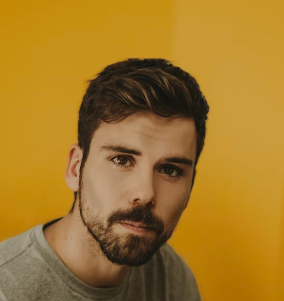 Man with beard yellow background